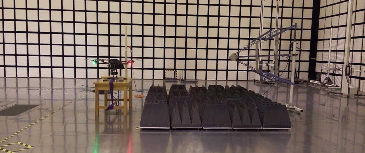 A drone under electromagnetic interference testing in an anechoic chamber